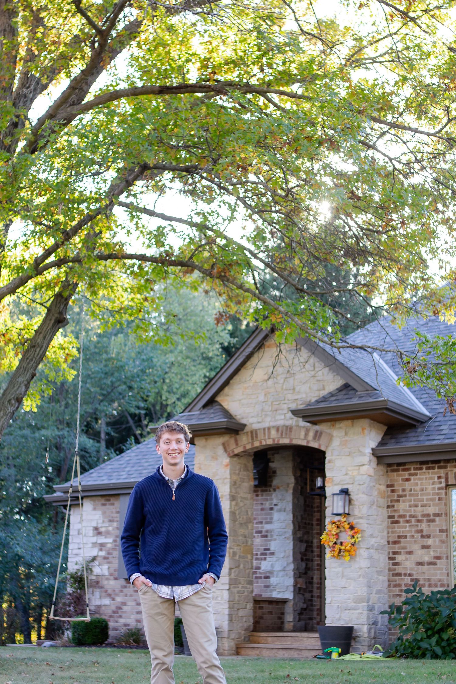 Sequence of photos showing a brick cottage with a stone entrance under autumn trees in a garden setting during his Hartland senior session