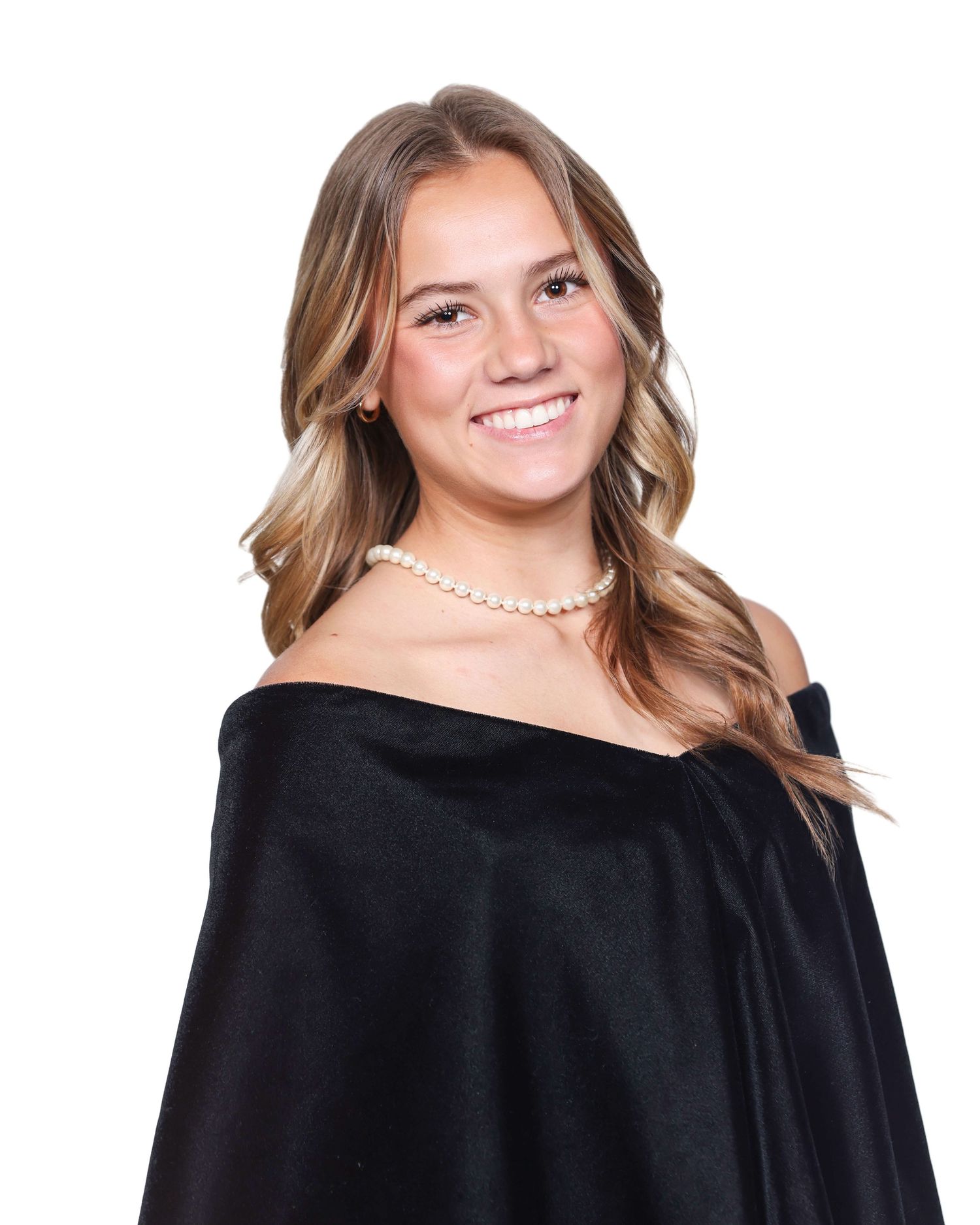 Woman in black off-shoulder dress poses in three similar graduation portraits with pearl necklace and wavy hair.