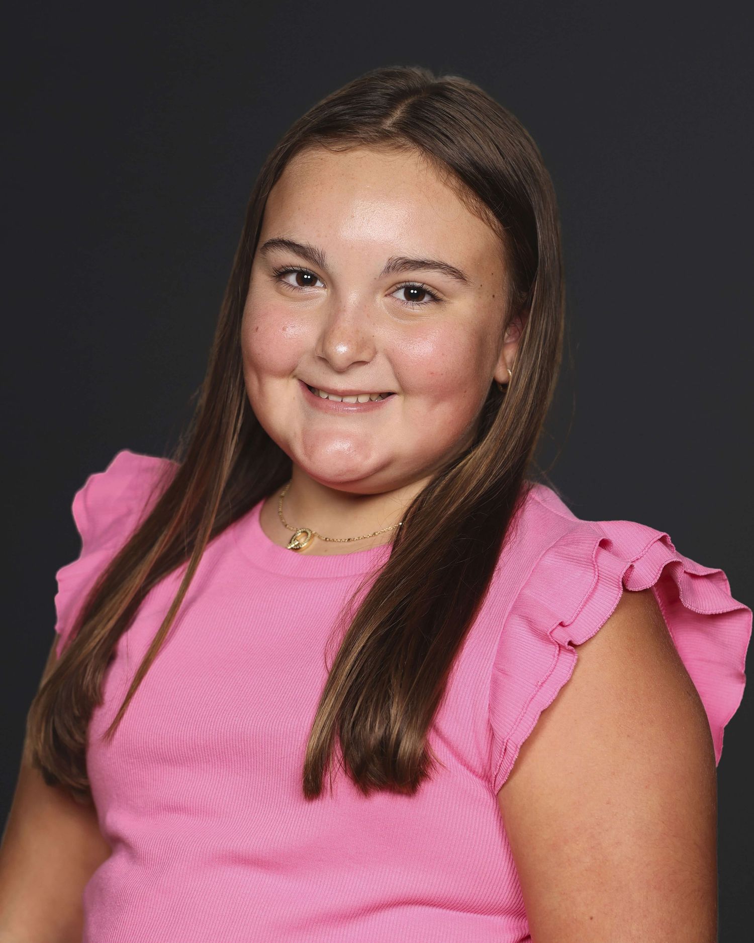 A series of five portraits showing someone in a pink sleeveless top against a dark background.
