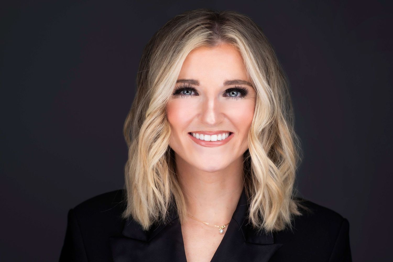 Professional headshots of women with blonde hair styled in waves against dark backdrop.
