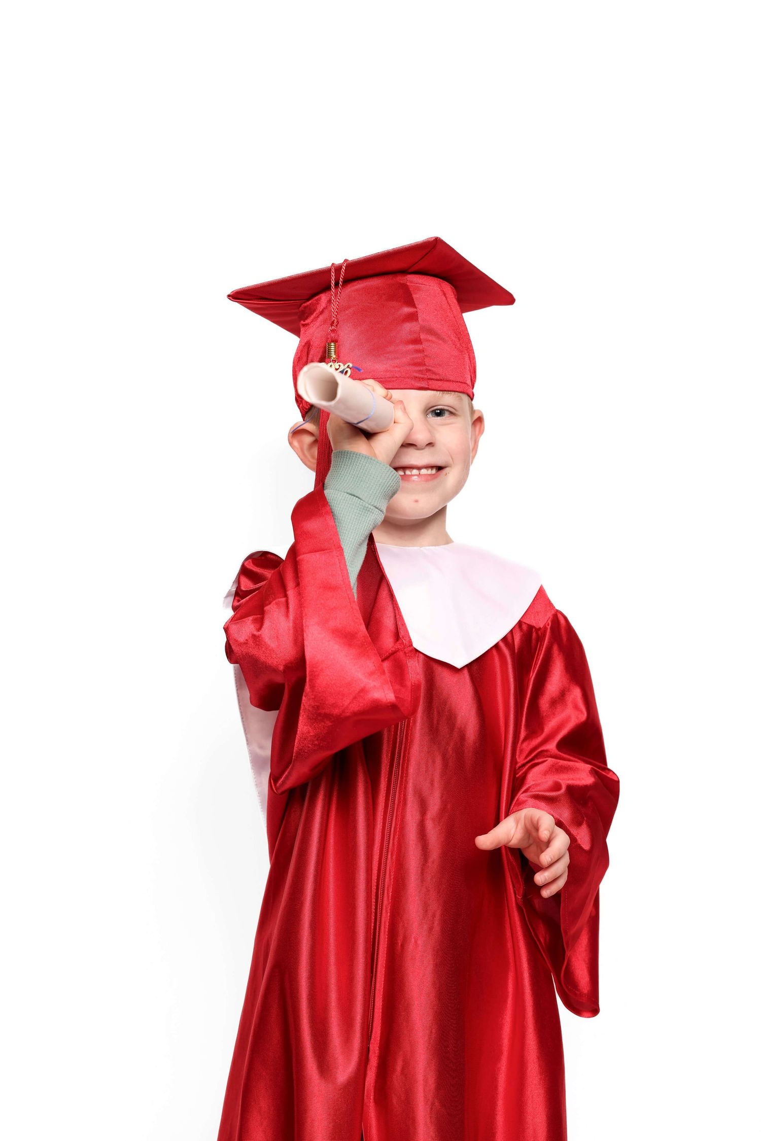A child in a bright red graduation cap and gown poses playfully in multiple shots.