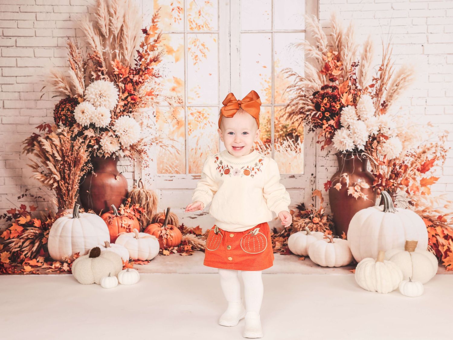A series of fall-themed photos with white pumpkins, orange bows, and rustic decorative elements against a brick wall backdrop.