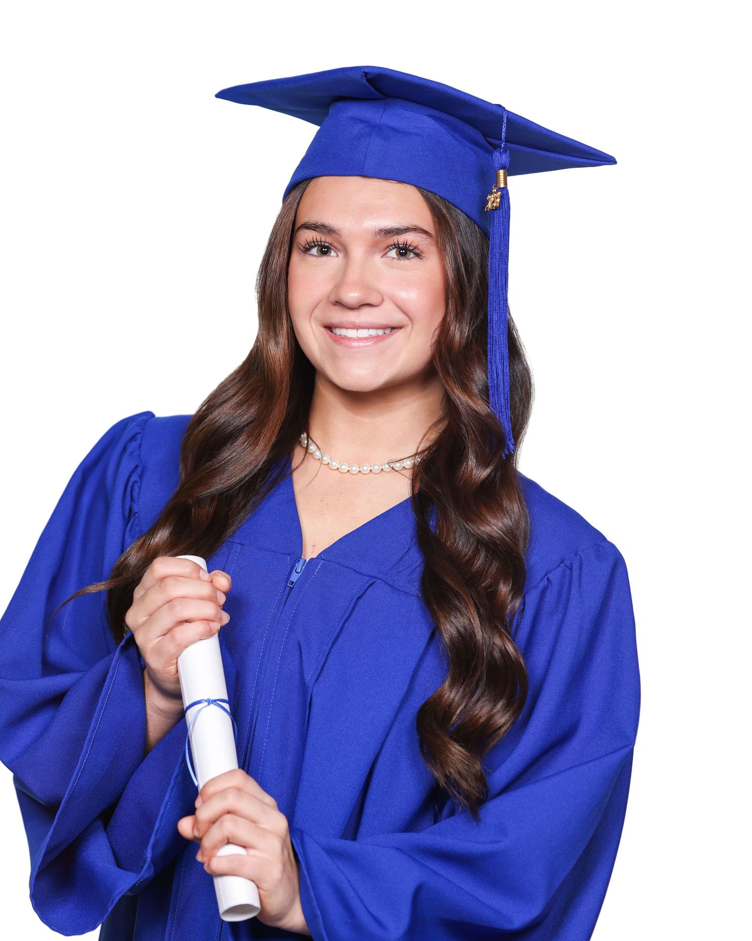 Graduate in royal blue cap and gown holds diploma while posing for graduation portraits.