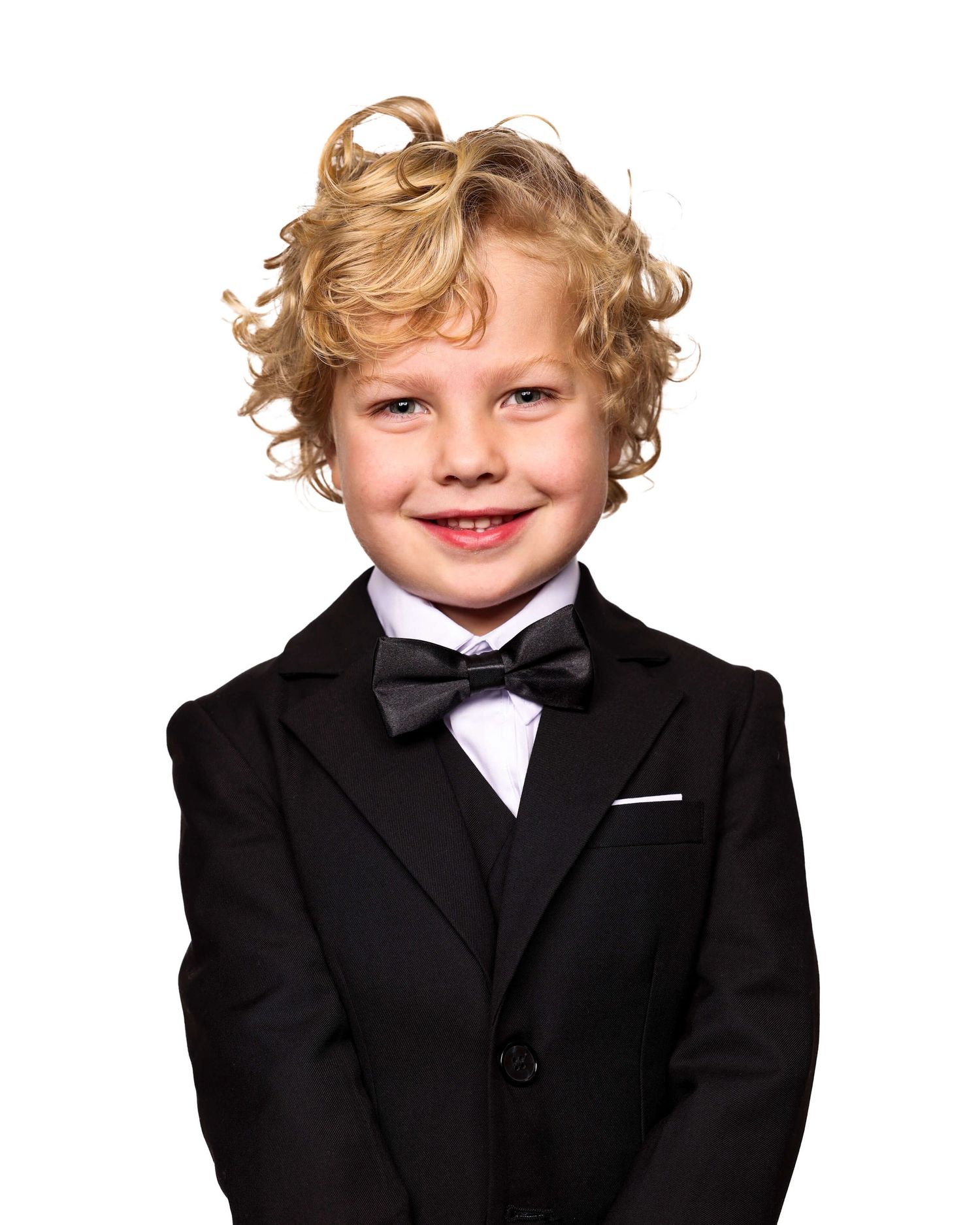 A child wearing a formal black suit and bow tie poses in a series of three similar headshots.