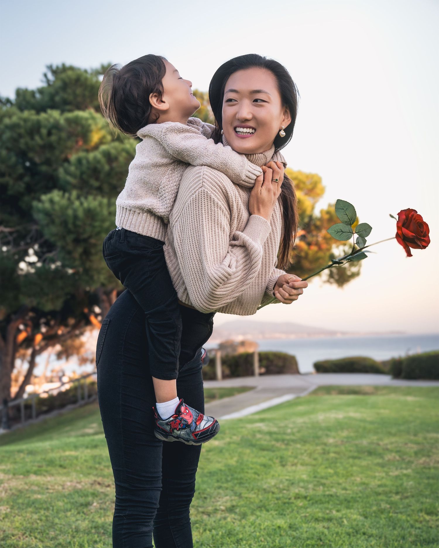 Sweet bonding moments between parent and child playing outdoors.
