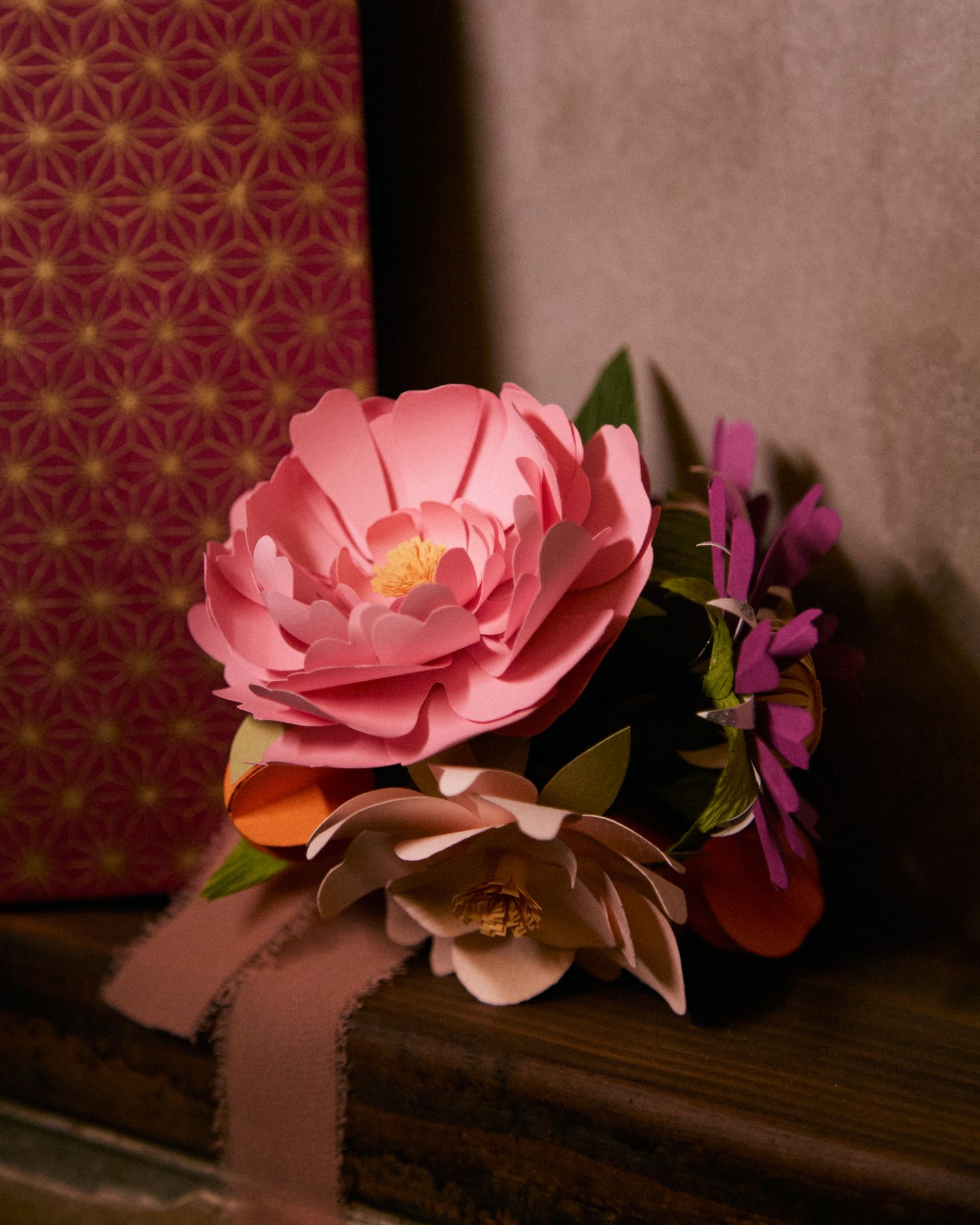 Elegant paper floral arrangement featuring a pink rose, designed for an intimate celebration.