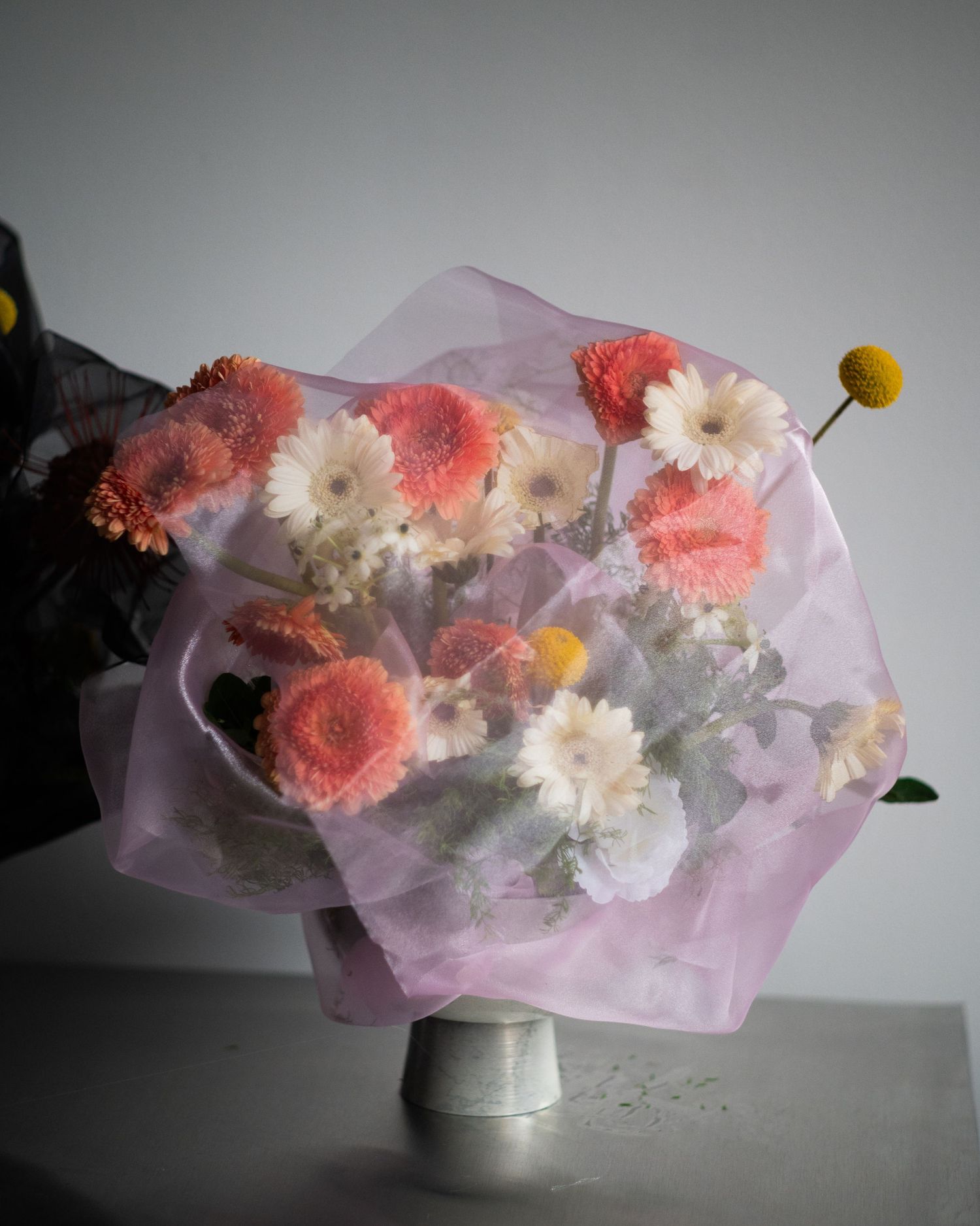 Hand-tied bouquet featuring pastel seasonal flowers, thoughtfully designed for an intimate celebration.