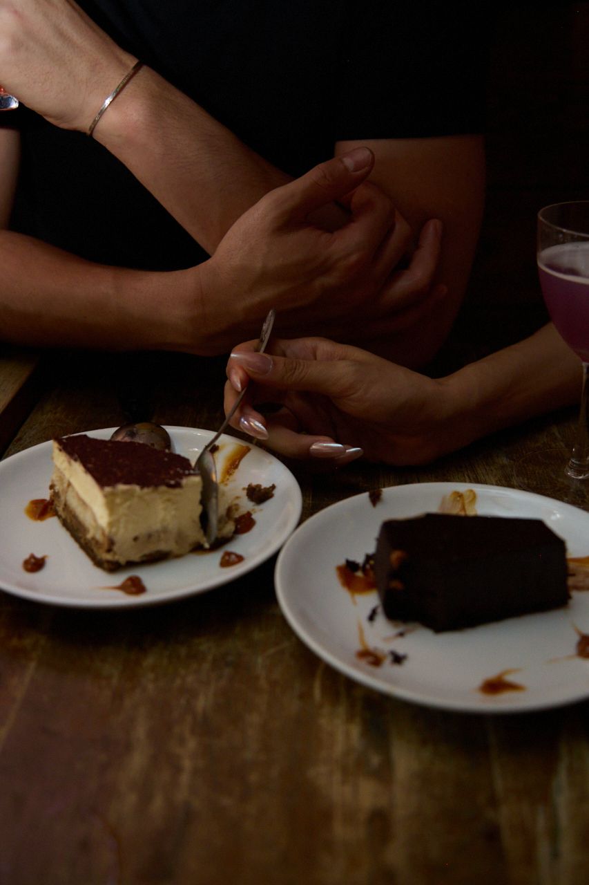 Couple sharing dessert during an intimate date, capturing a candid lifestyle moment.