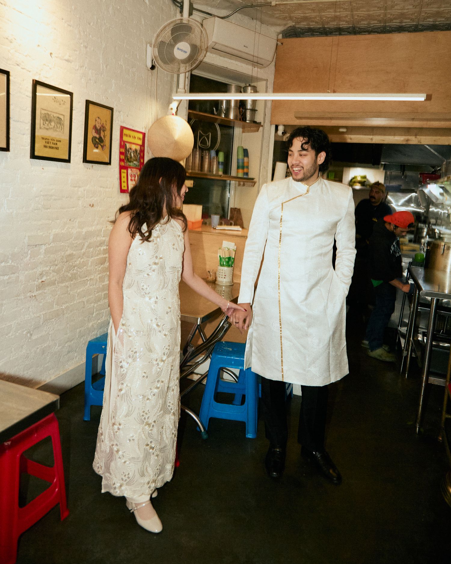 Couple walking hand in hand during an intimate engagement photo session.