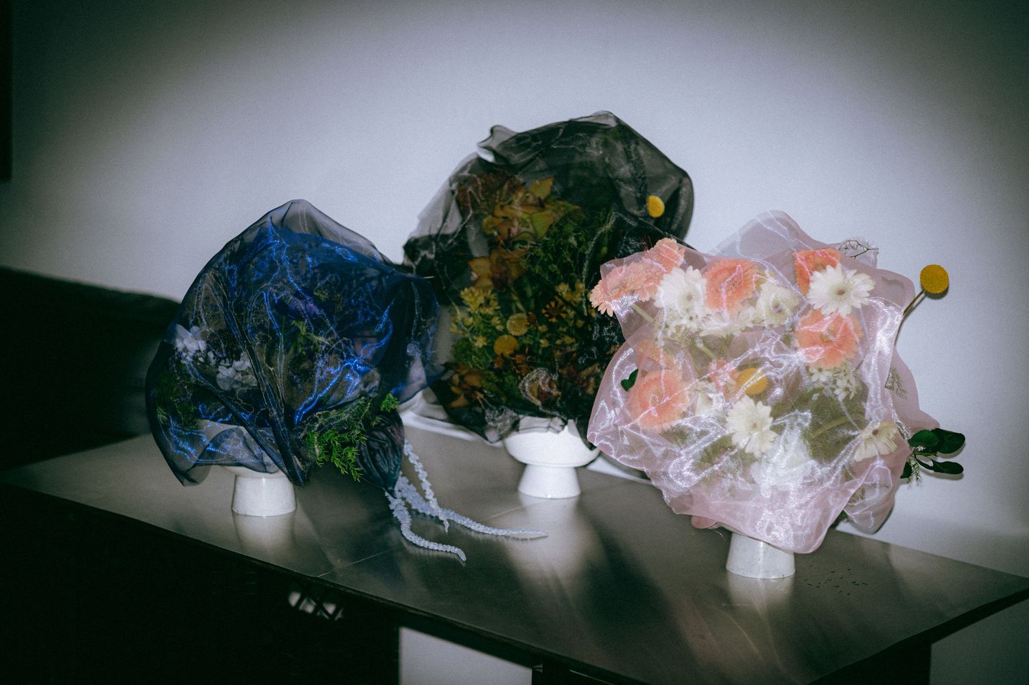 Custom floral bouquets displayed together, showcasing artistic floral design for intimate celebrations and special events.