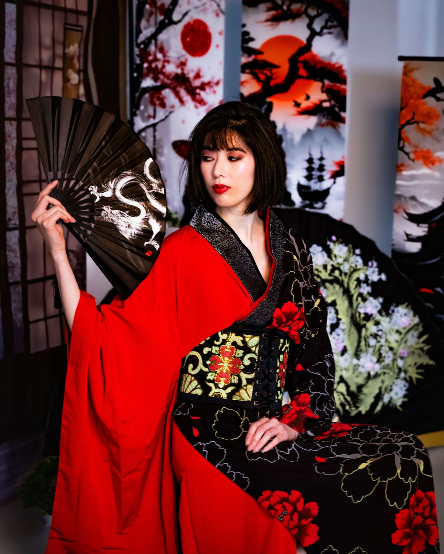 Dramatic fashion photos featuring a red and black kimono with fan accessories in Japanese style.