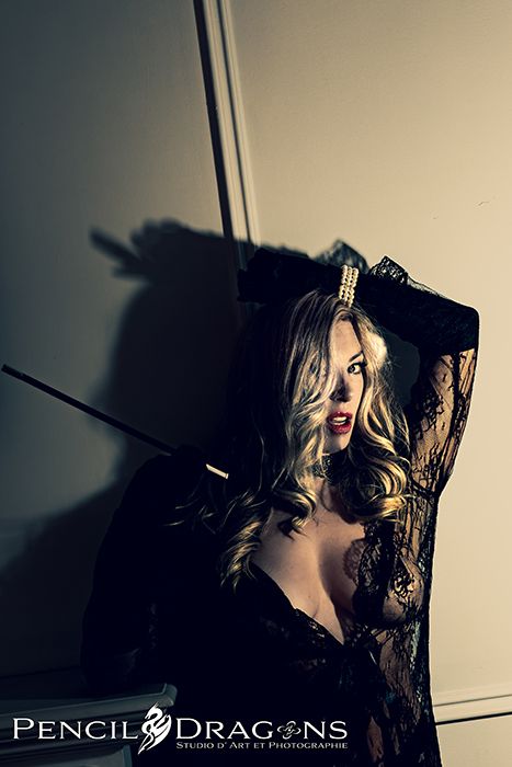 Moody portrait series with dramatic shadows and lace details against neutral background.