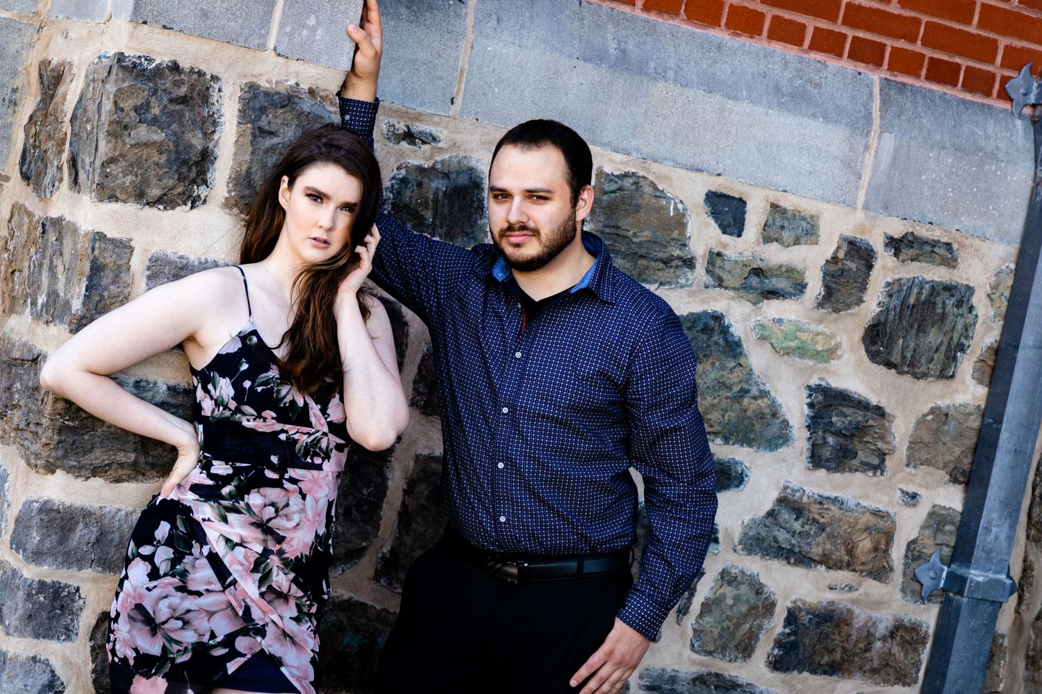 Romantic couple photo series against rustic stone wall background.