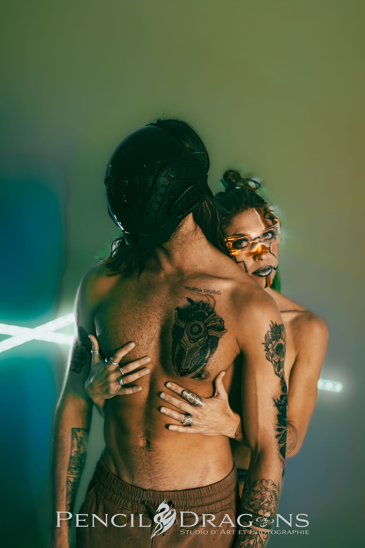Artistic series showing tattooed figures in intimate poses with dramatic lighting.