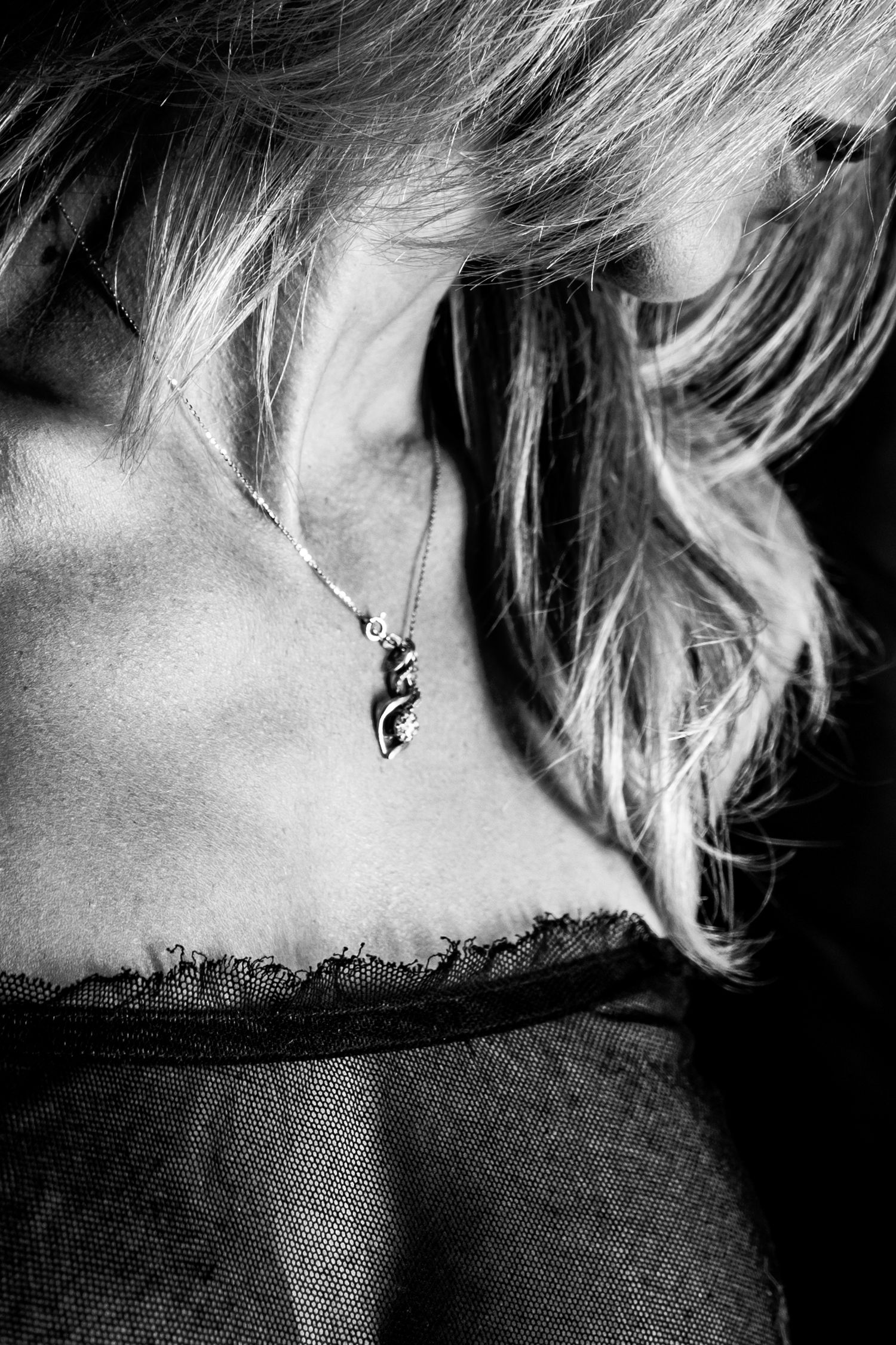 Black and white close-up series focusing on earrings and neck details.