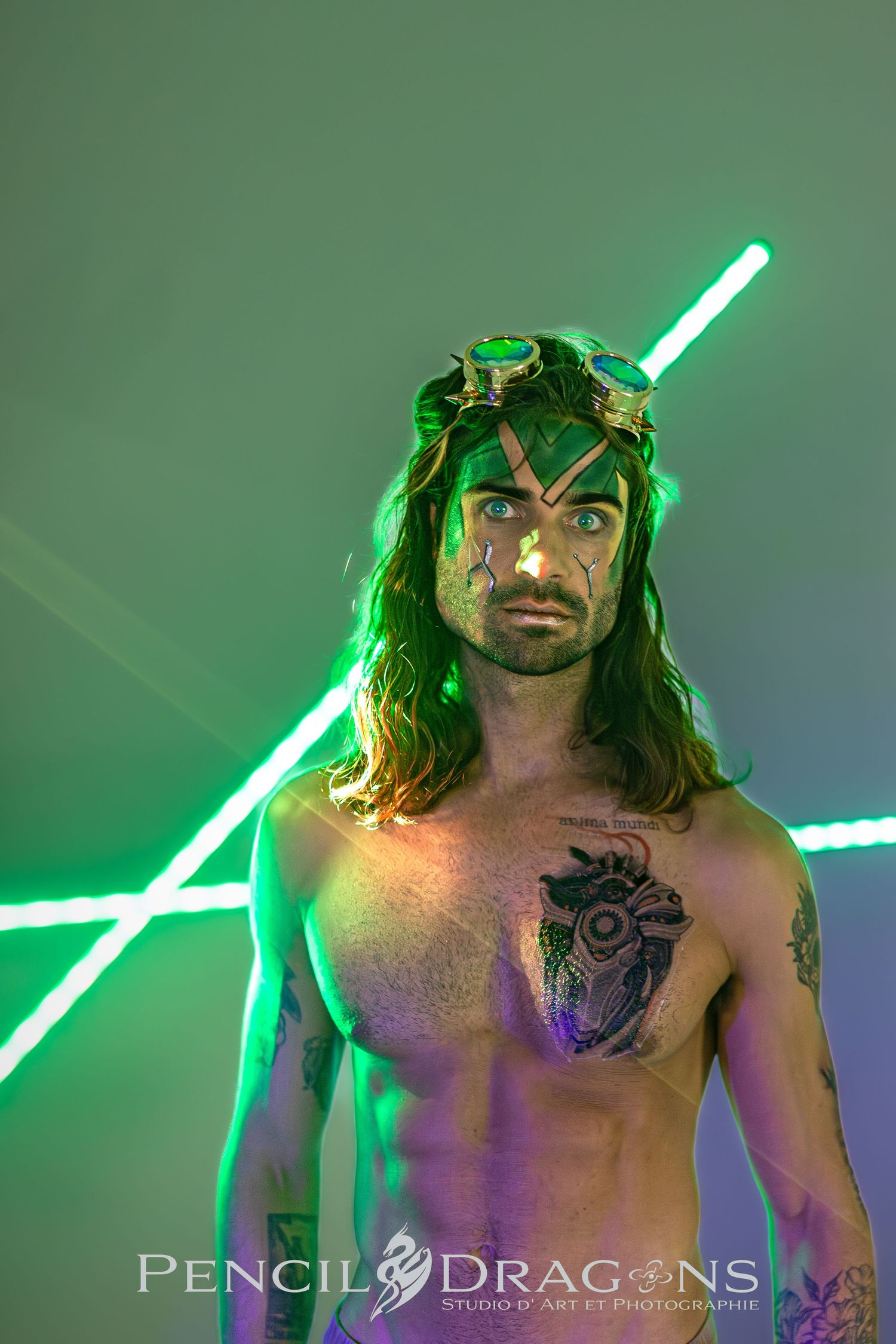 Dramatic portrait sequence with green neon lighting and shirtless figure.