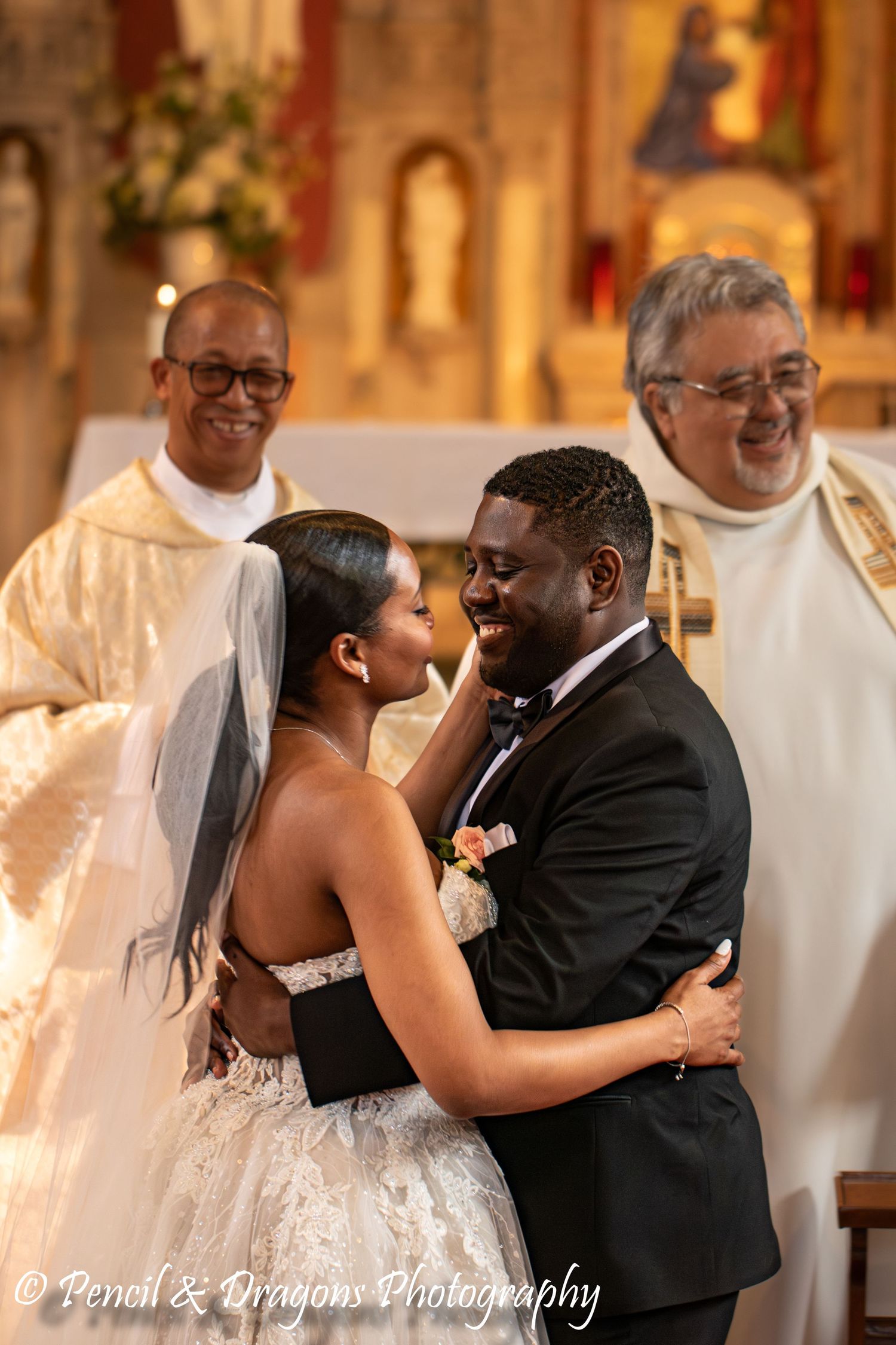 Romantic first dance moment in an elegant church setting with warm lighting.