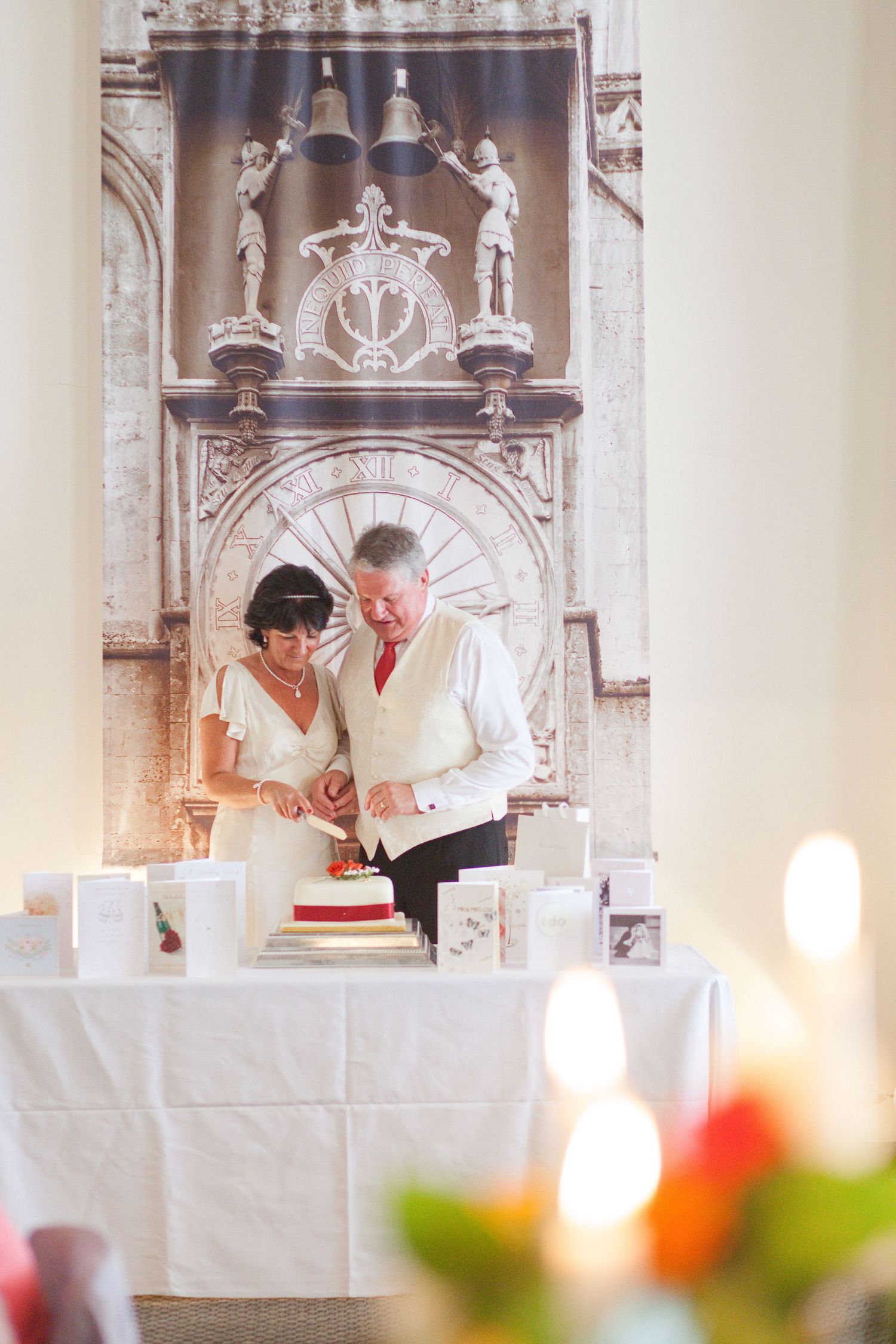 Wedding reception venue with ornate gothic architecture and white-clothed tables.