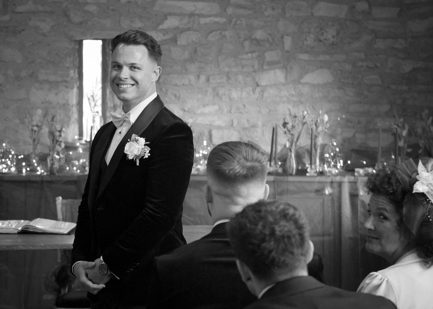 Wedding celebration candid moments captured in black and white photography.