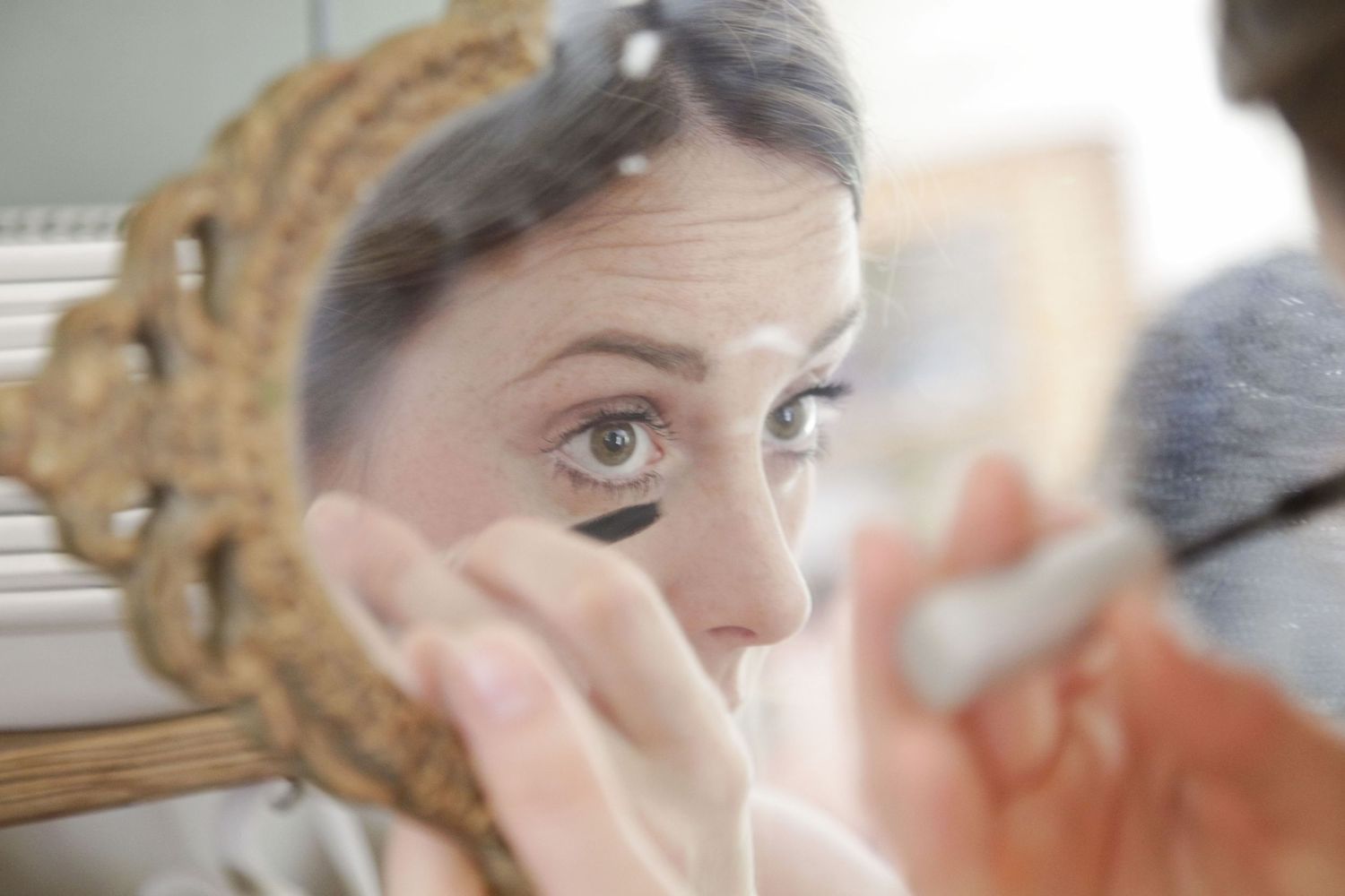 Close-up shots showing makeup application and preparation details.