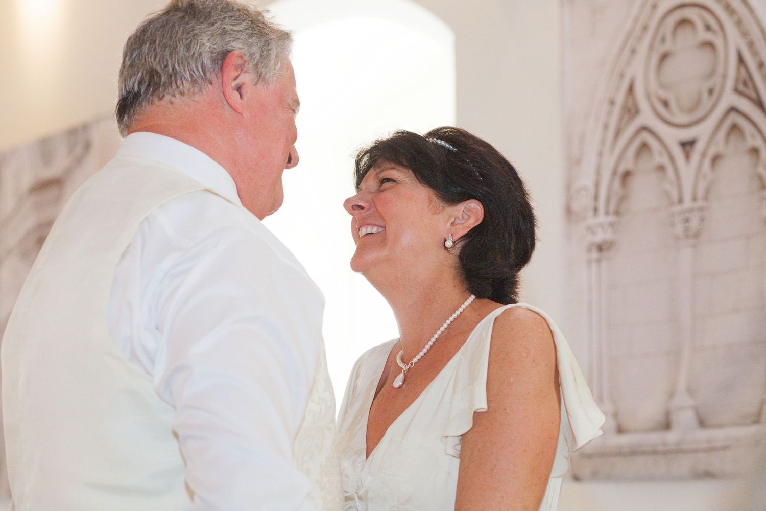A couple shares a romantic dance moment at their wedding celebration.