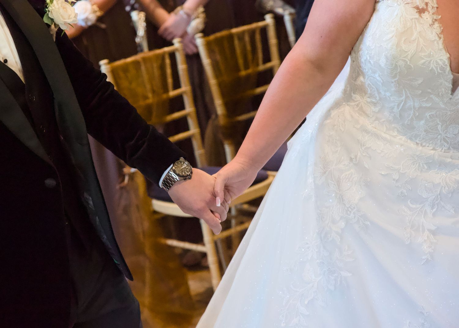 Close-up details of wedding ceremony moments with elegant decor and wooden chairs.