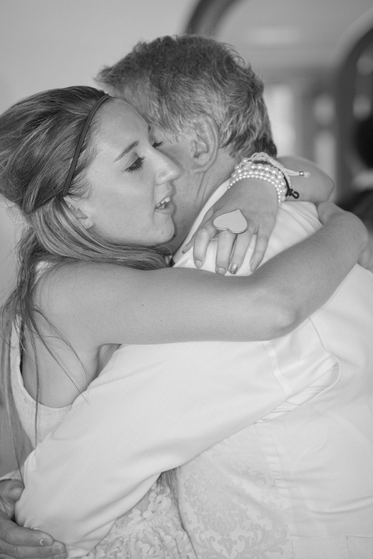 Black and white emotional embrace captured in a candid moment.
