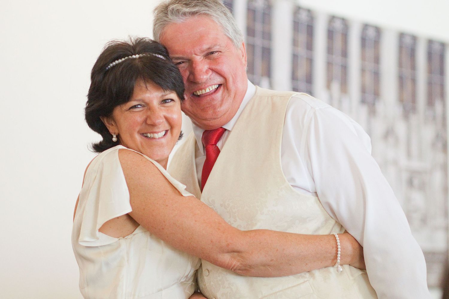 Candid moments of laughter and joy shared during an elegant wedding reception.