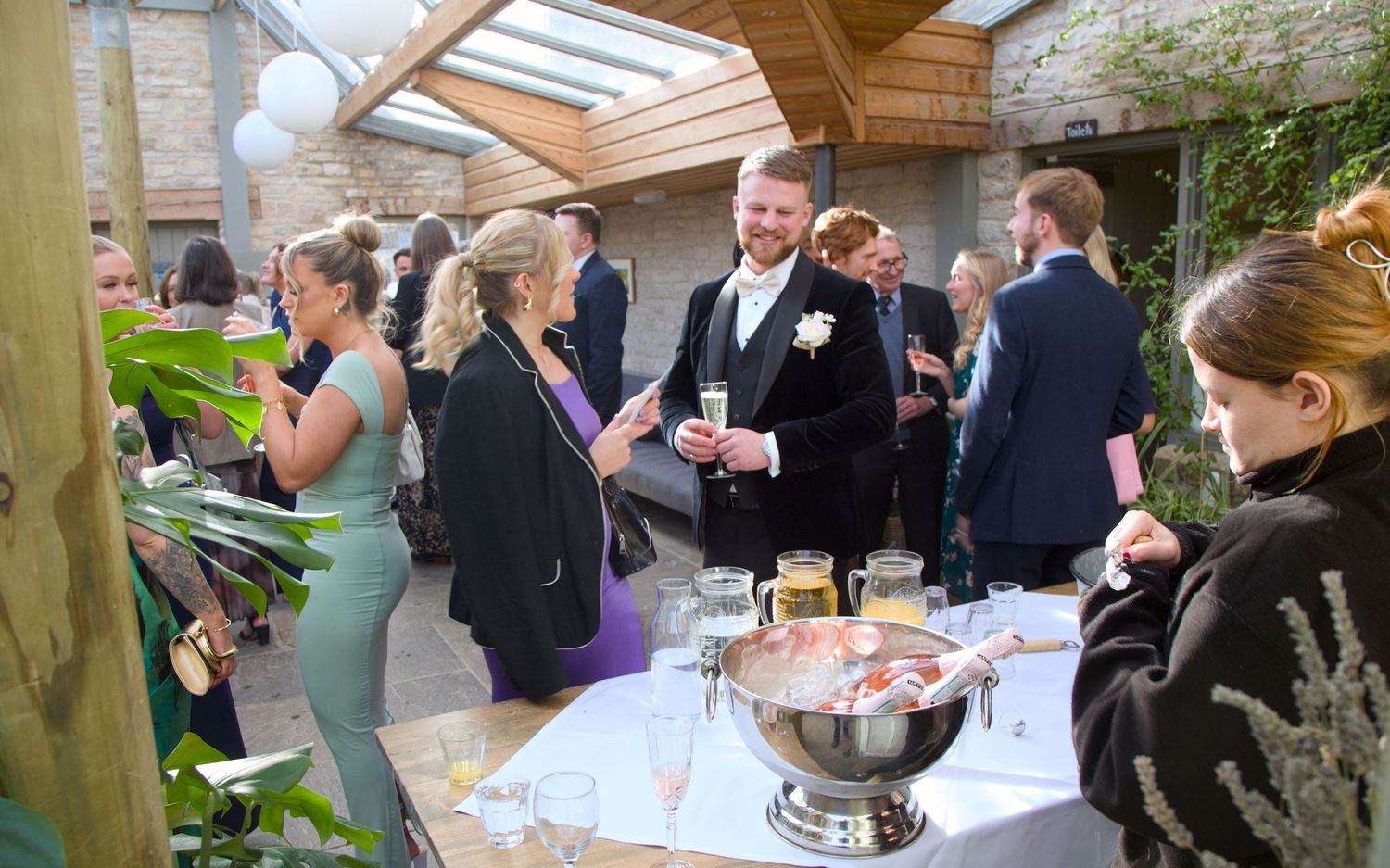 Guests at a winter wedding during a wedding photography shoot at Folly Farm, Somerst, near Bristol in south west England.