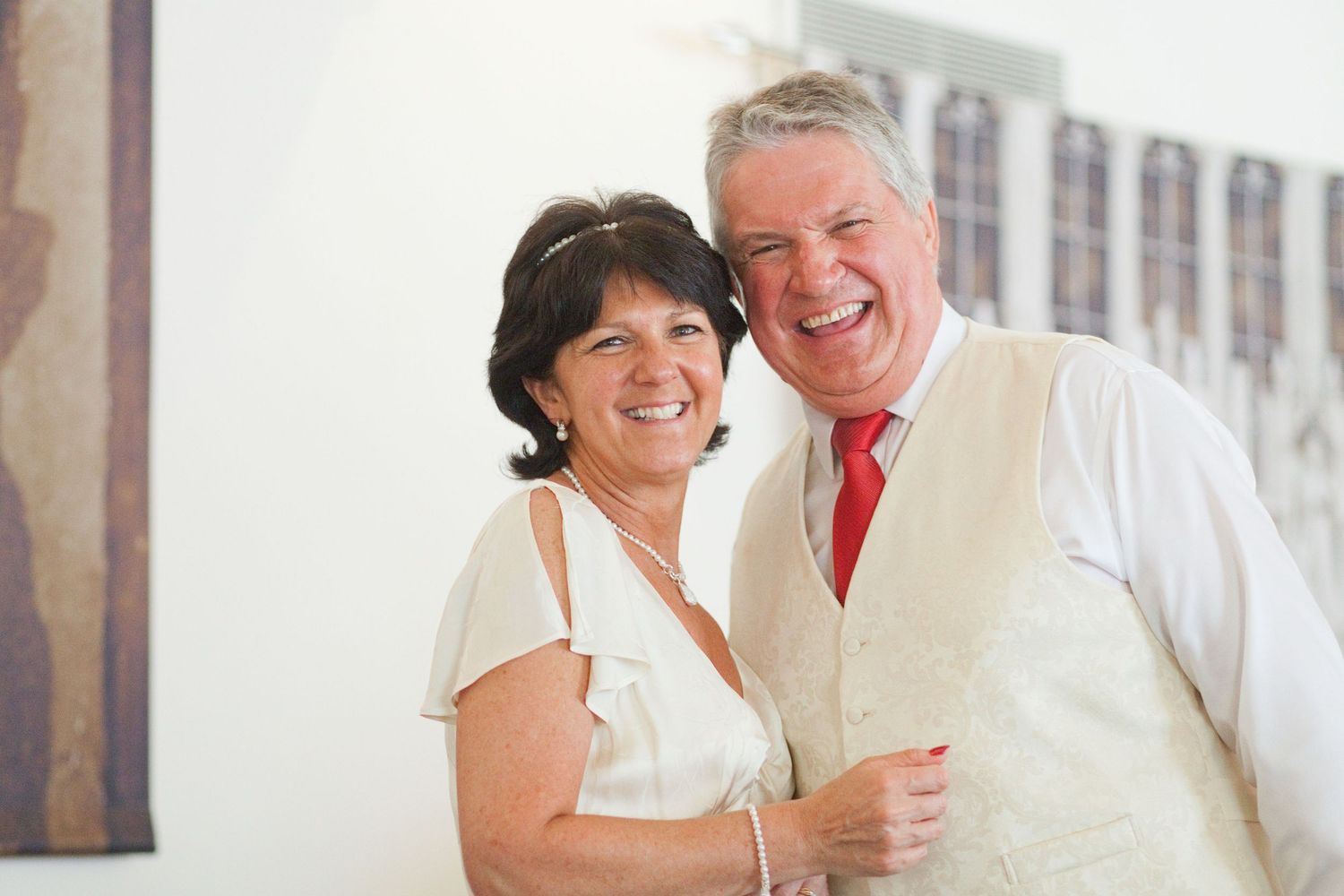 Intimate candid moments captured between guests at an elegant wedding celebration.