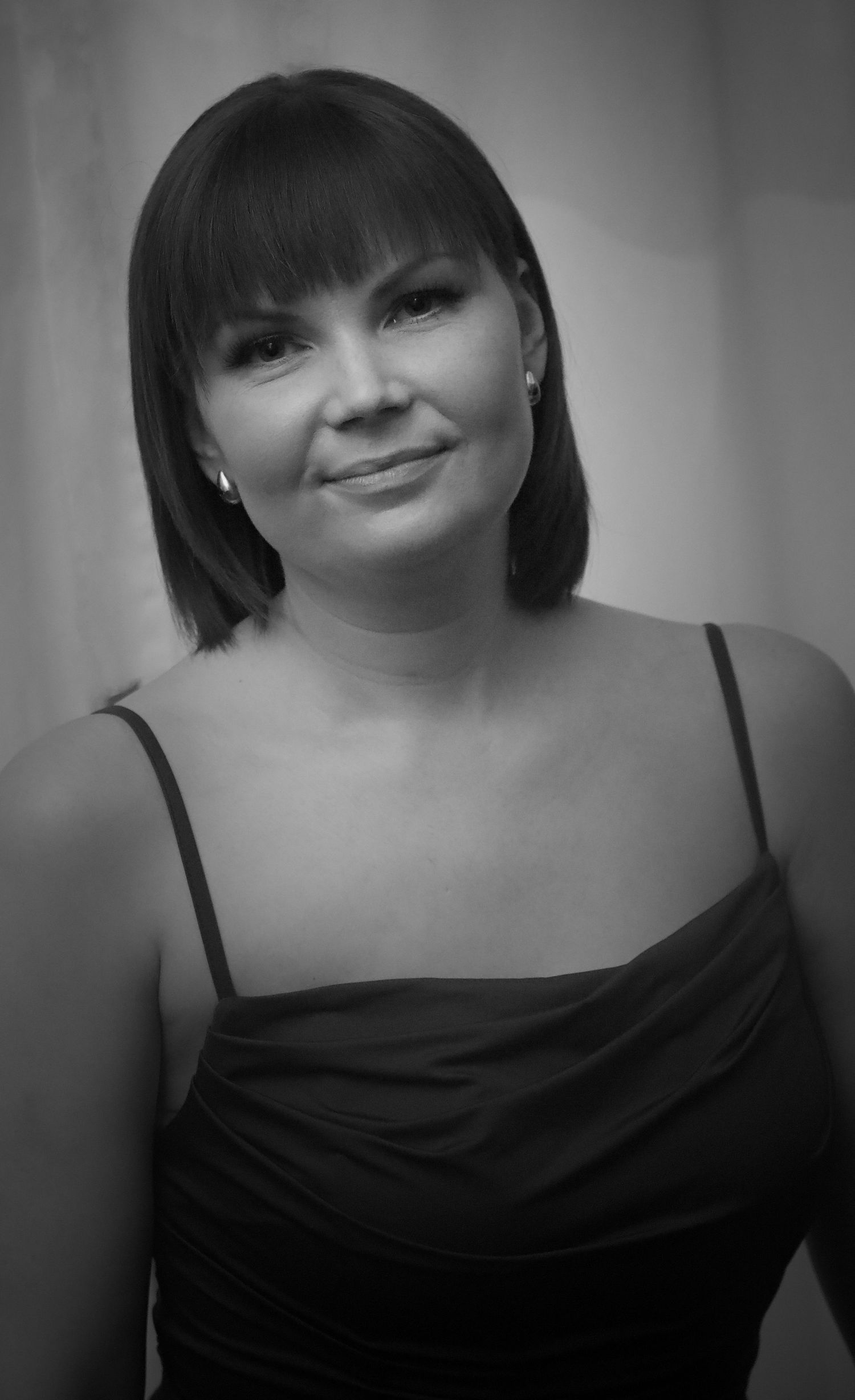 Black and white portrait series showing different expressions and poses.