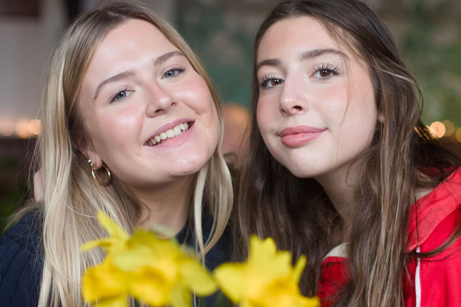 Two friends sharing joyful moments together in a series of close-up photos with yellow flowers and warm lighting.