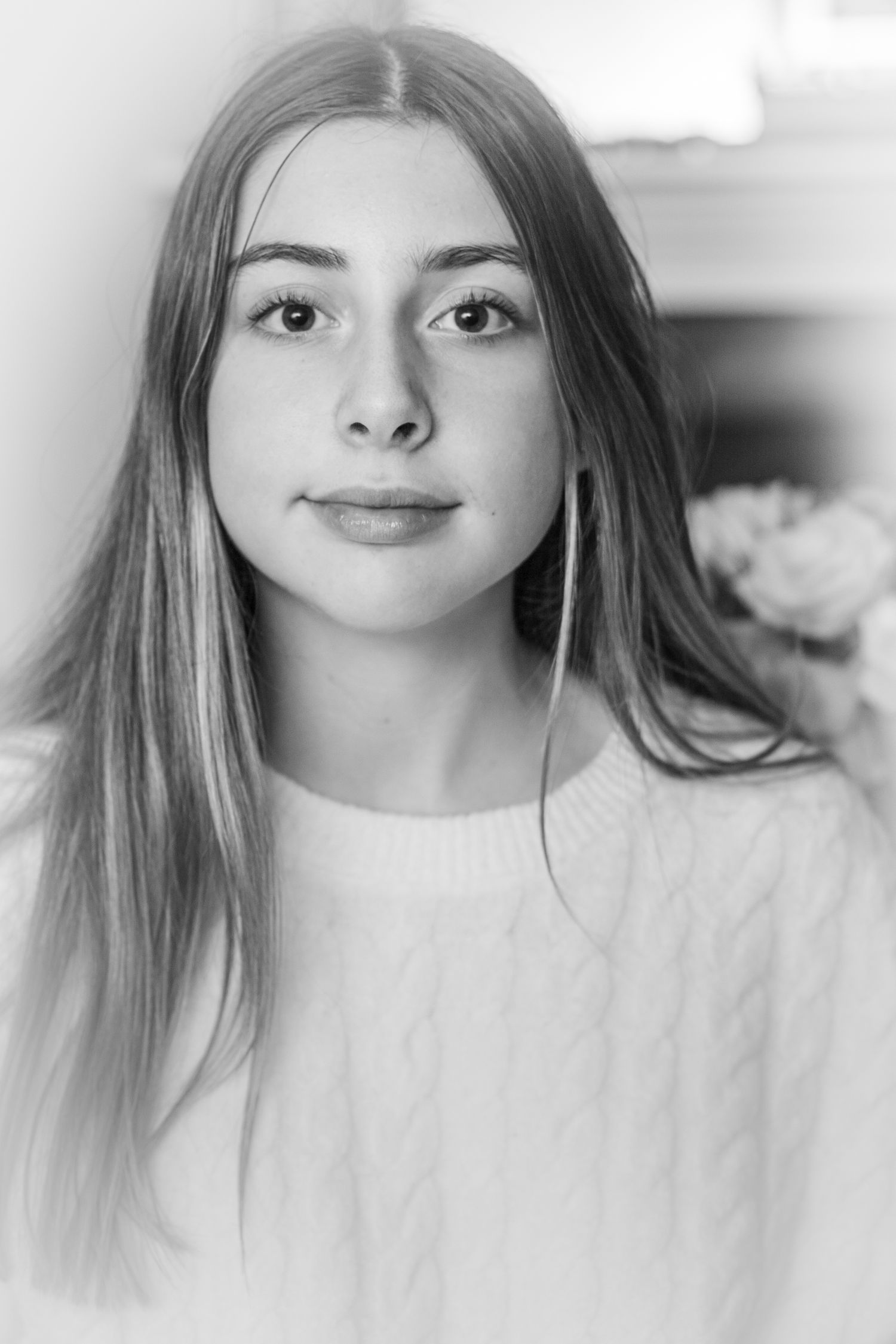 A series of black and white portrait photos showing different angles and expressions in a minimalist style.