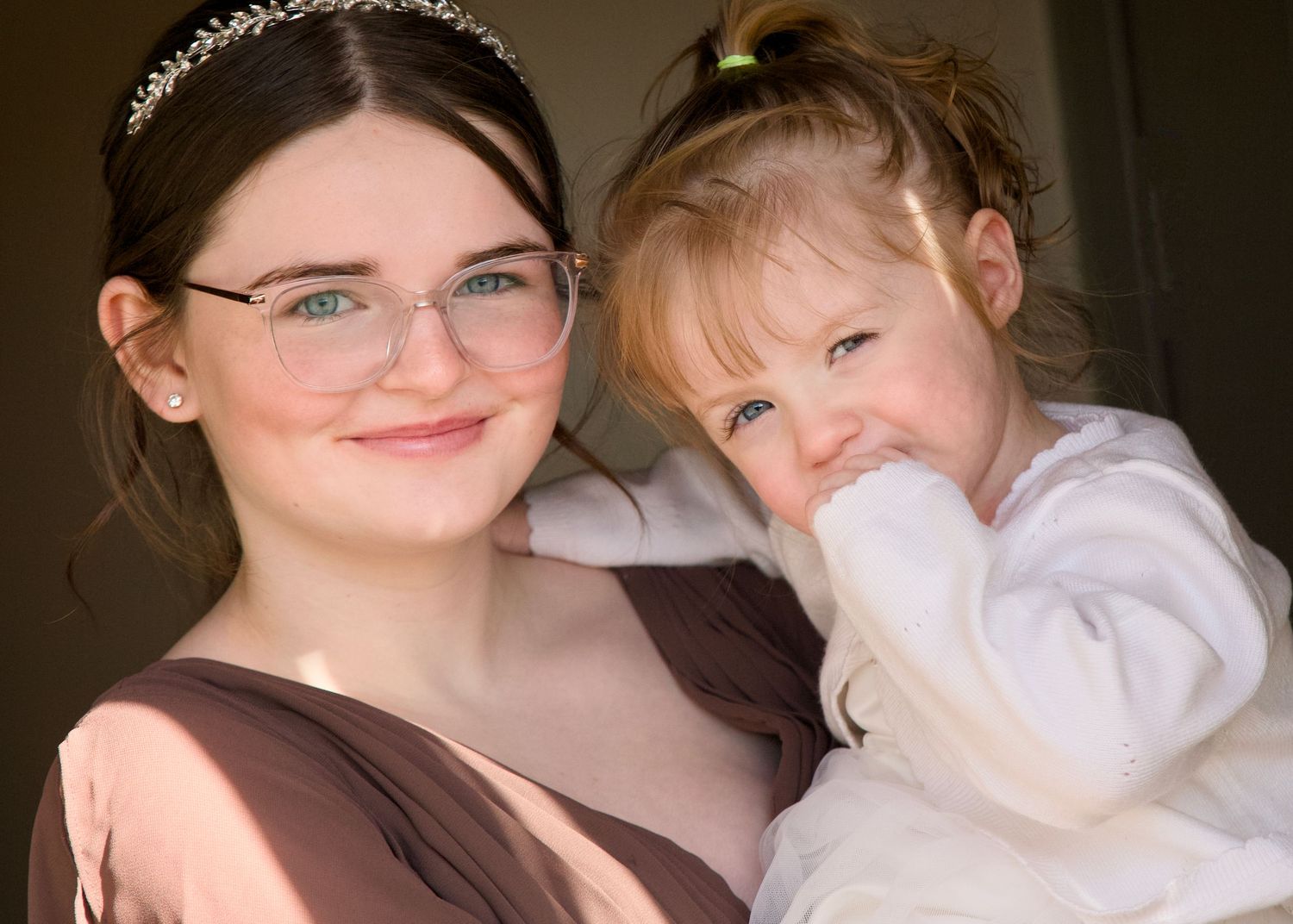 Tender moment between loved ones at a wedding celebration.