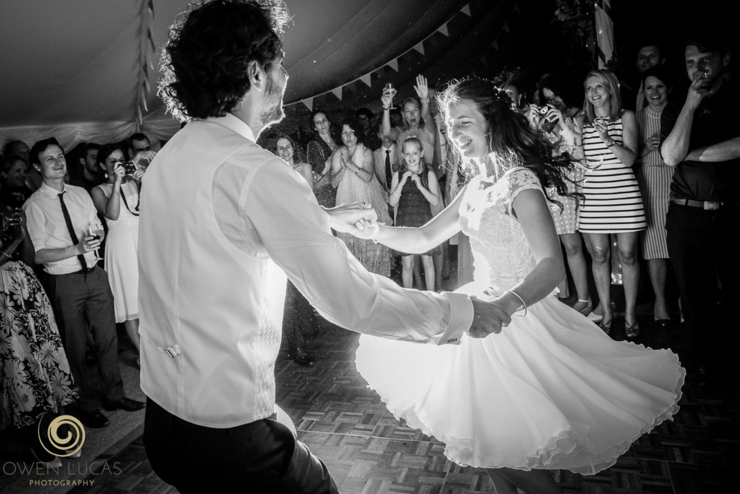 Bride and groom enjoying their first danace at a coastal wedding reception.