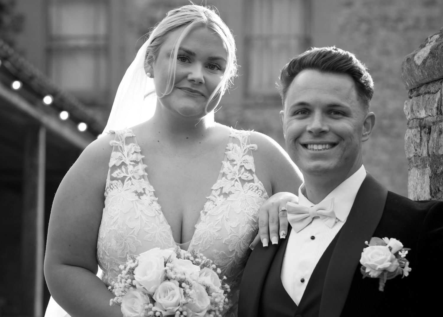 Black and white romantic portraits of newlyweds on their wedding day.