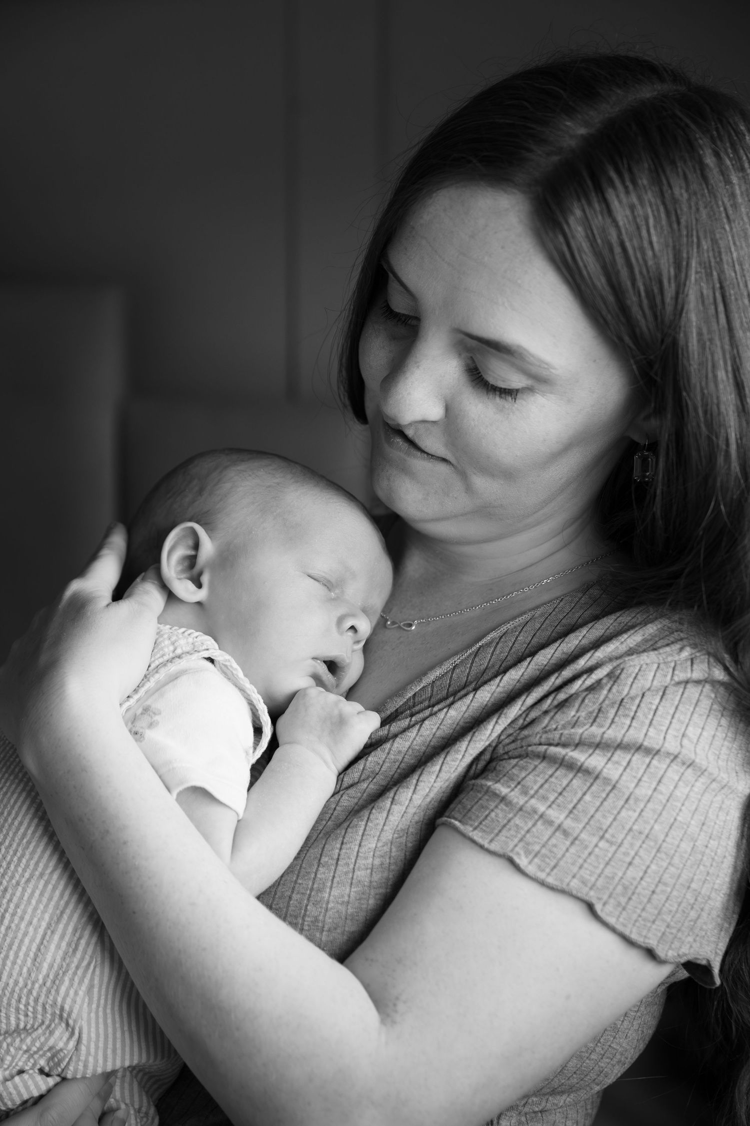 Intimate black and white portraits showing tender moments between parent and child.