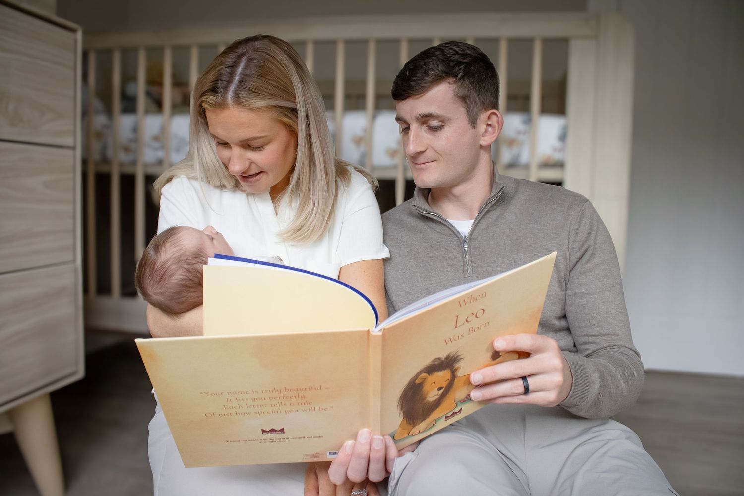 Couple sharing an intimate moment while reading a book together on a comfortable couch.
