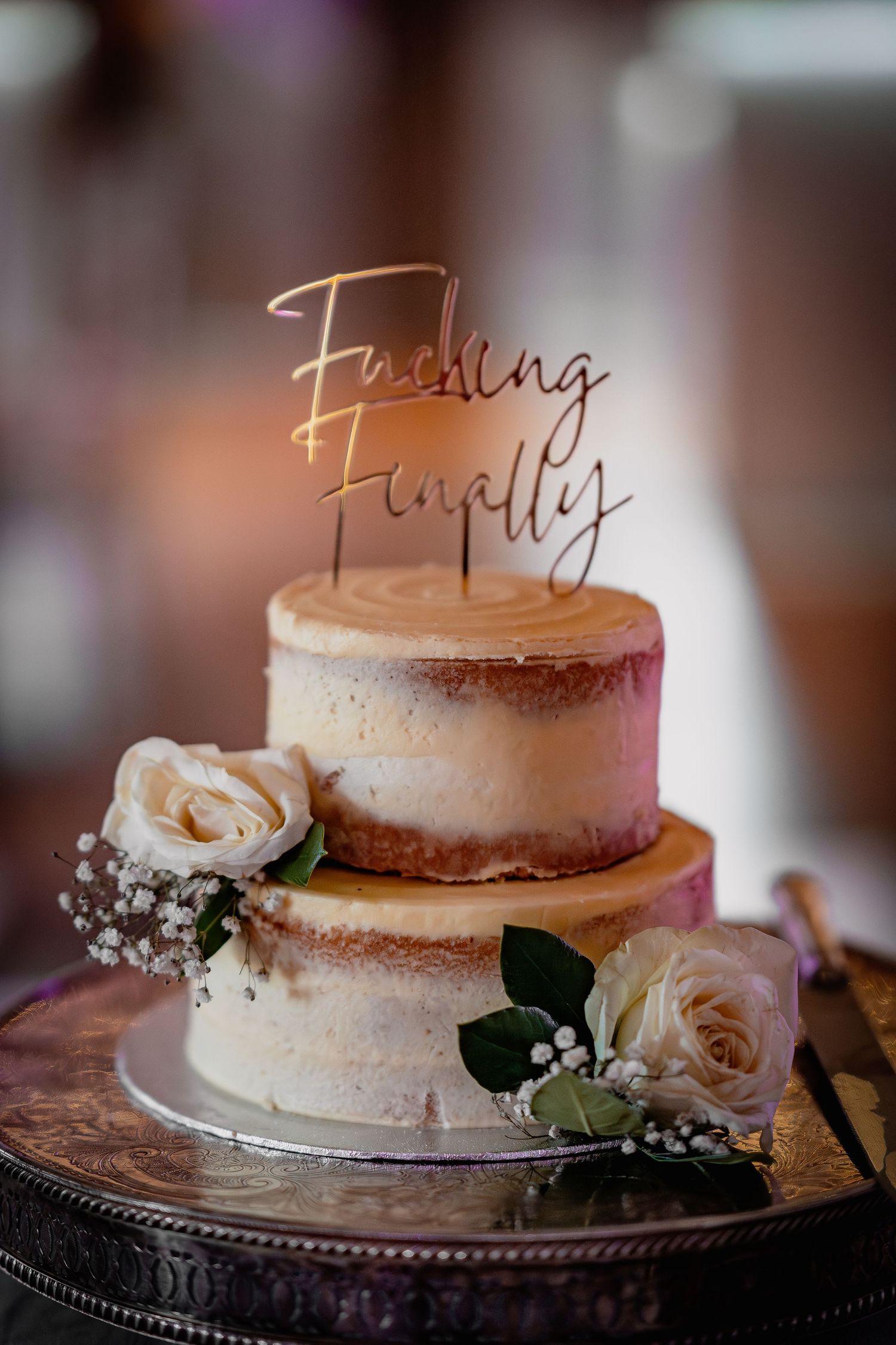 Two-tier semi-naked wedding cake with gold 