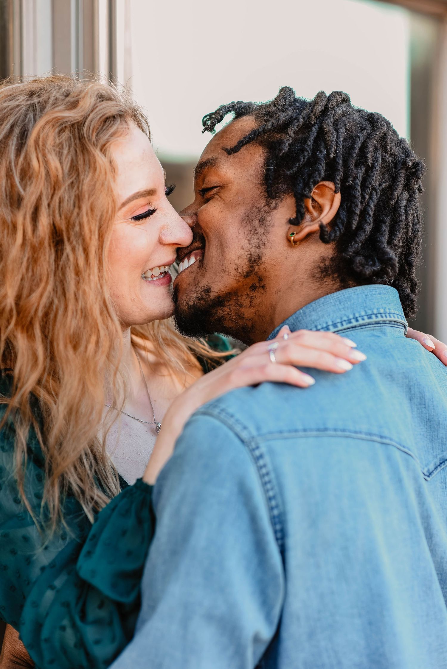 A romantic couple sharing intimate kisses in a sequence of close-up photos against a blurred background.