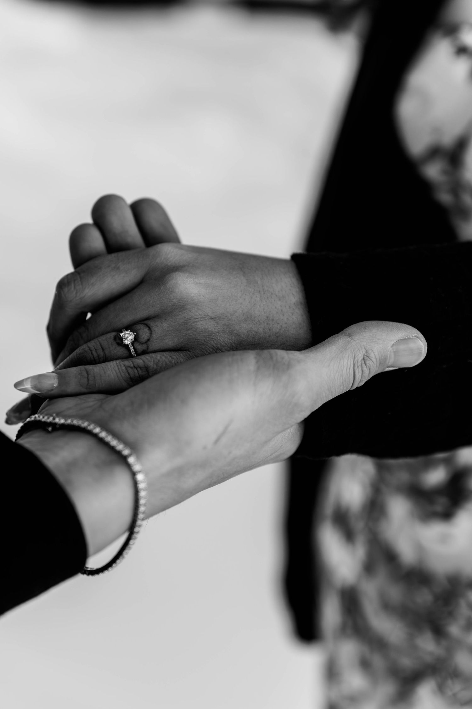 Close-up sequence of hands with bracelet showing an intimate moment.