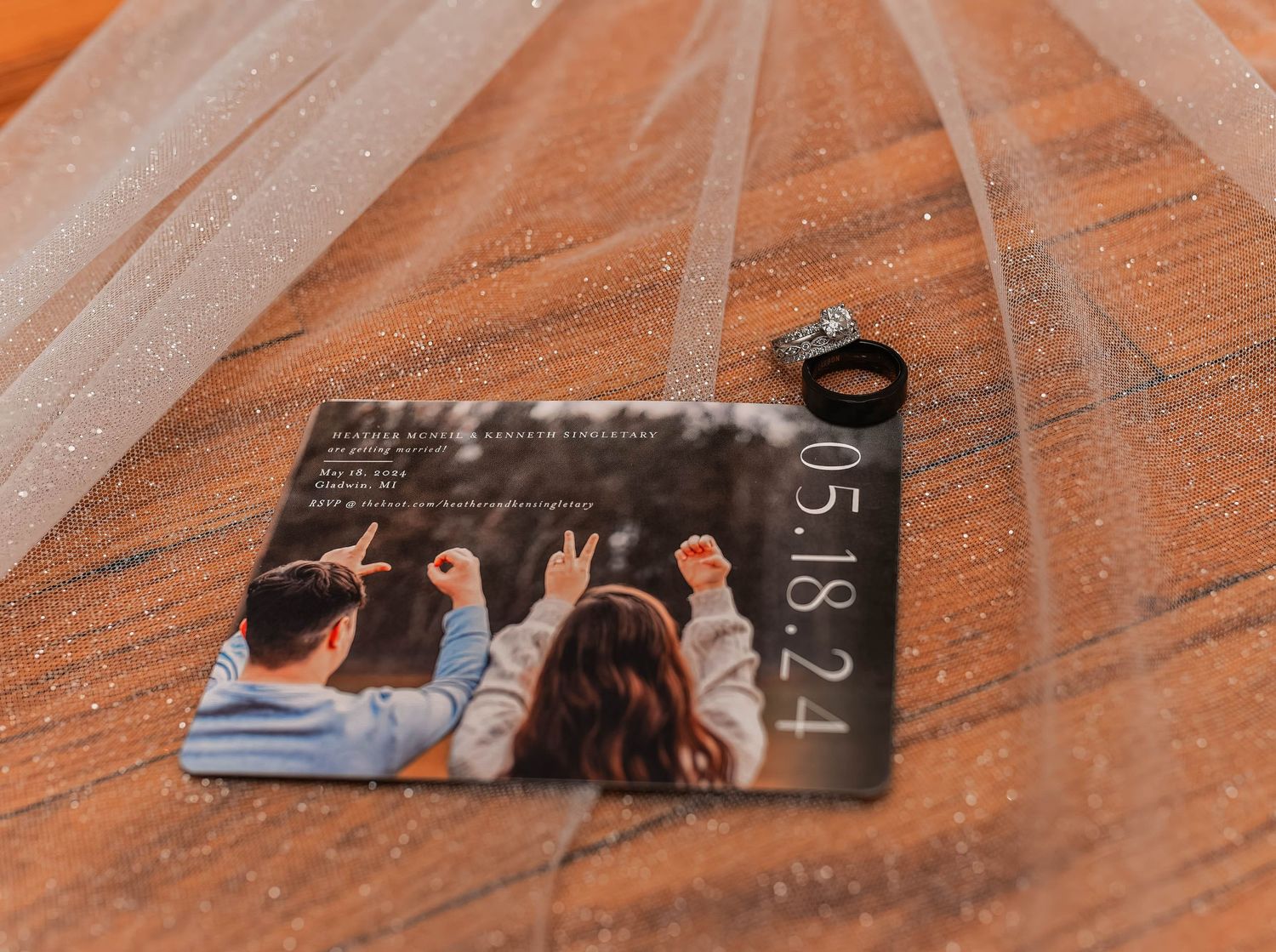 Creative wedding photo composition showing couple lying on brick surface from above.