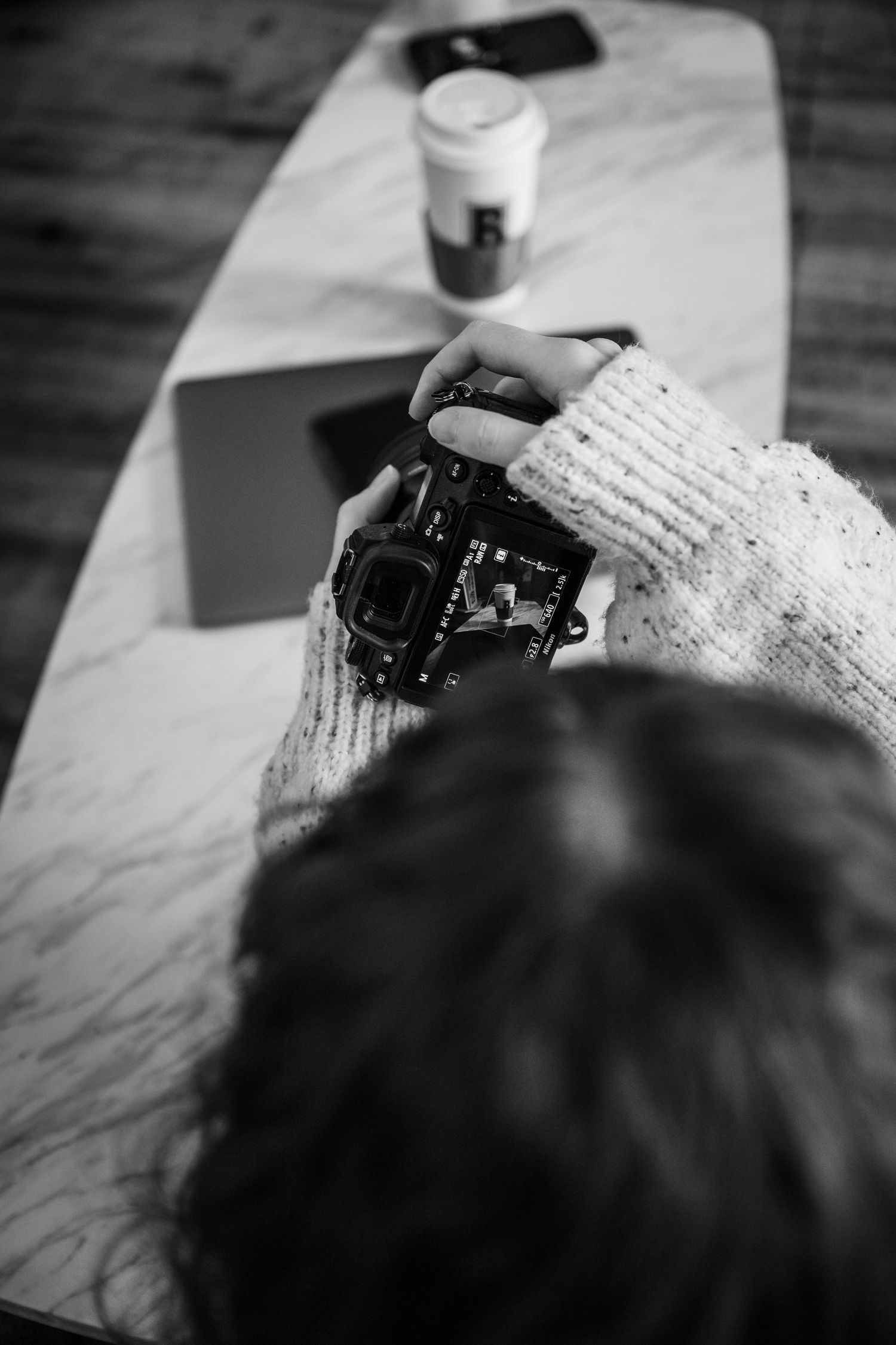 Black and white photo sequence showing someone writing in a notebook or journal with close-up shots of handwriting.