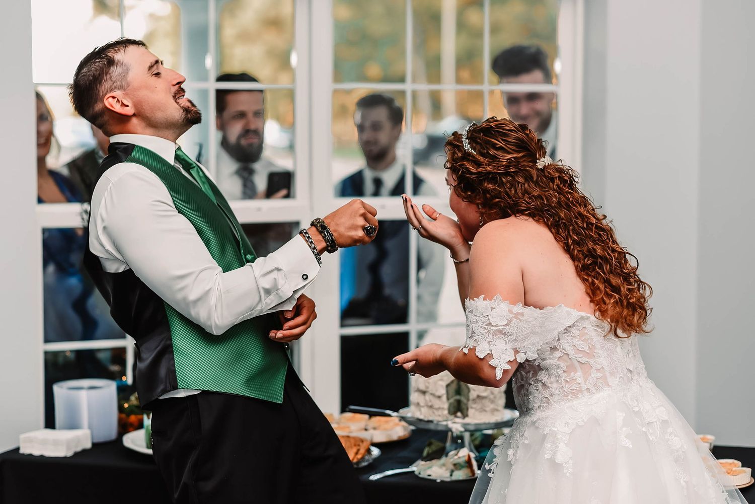 Wedding reception celebration with dancing and joyful moments in bright indoor venue.