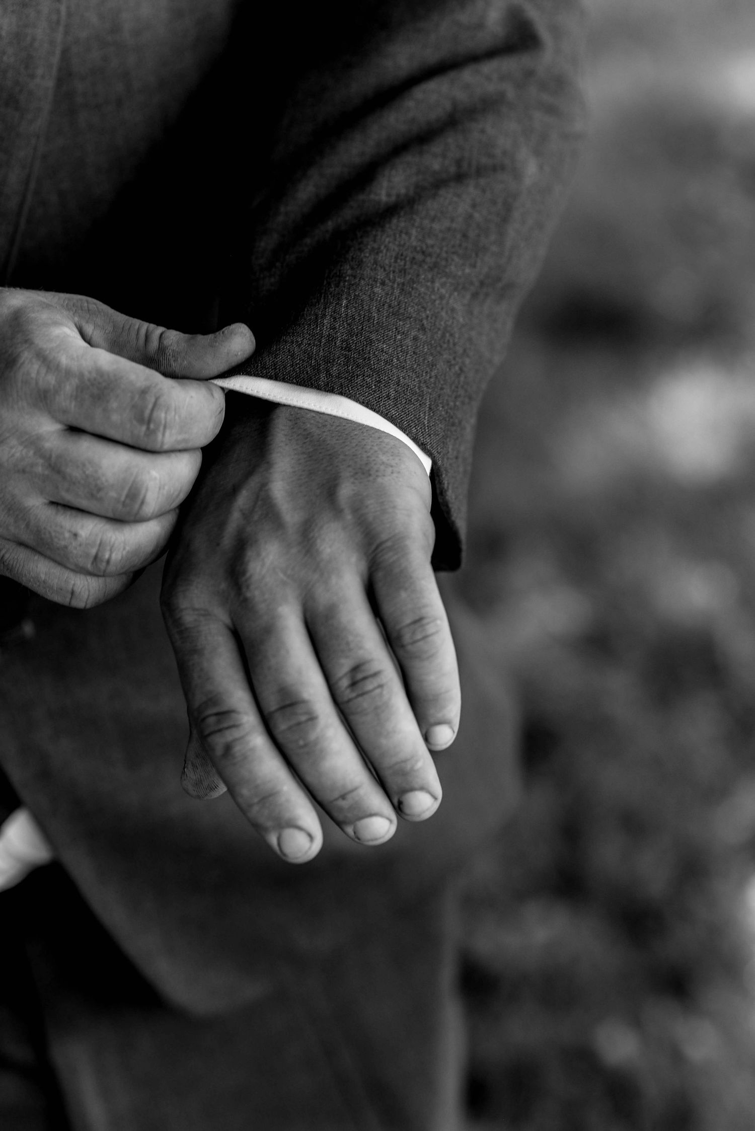 Black and white close-up series of hands showing wedding rings and details.