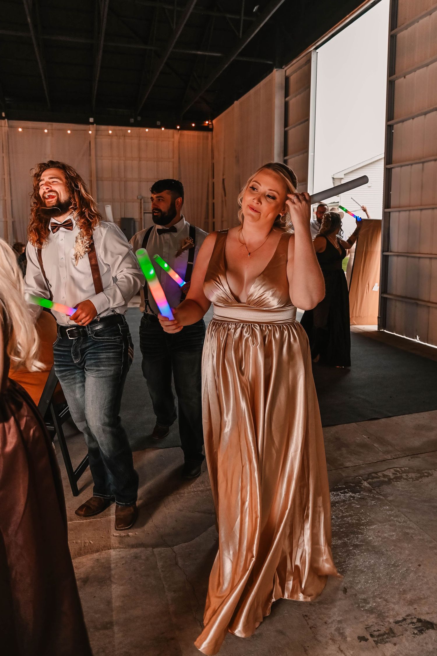 Couple performing a dramatic dance dip during their wedding reception.