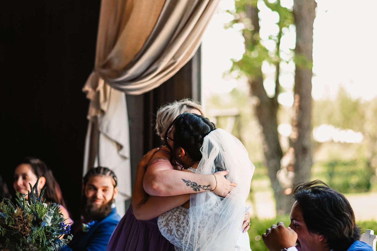 Romantic wedding portraits captured in natural outdoor lighting with soft bokeh effects.