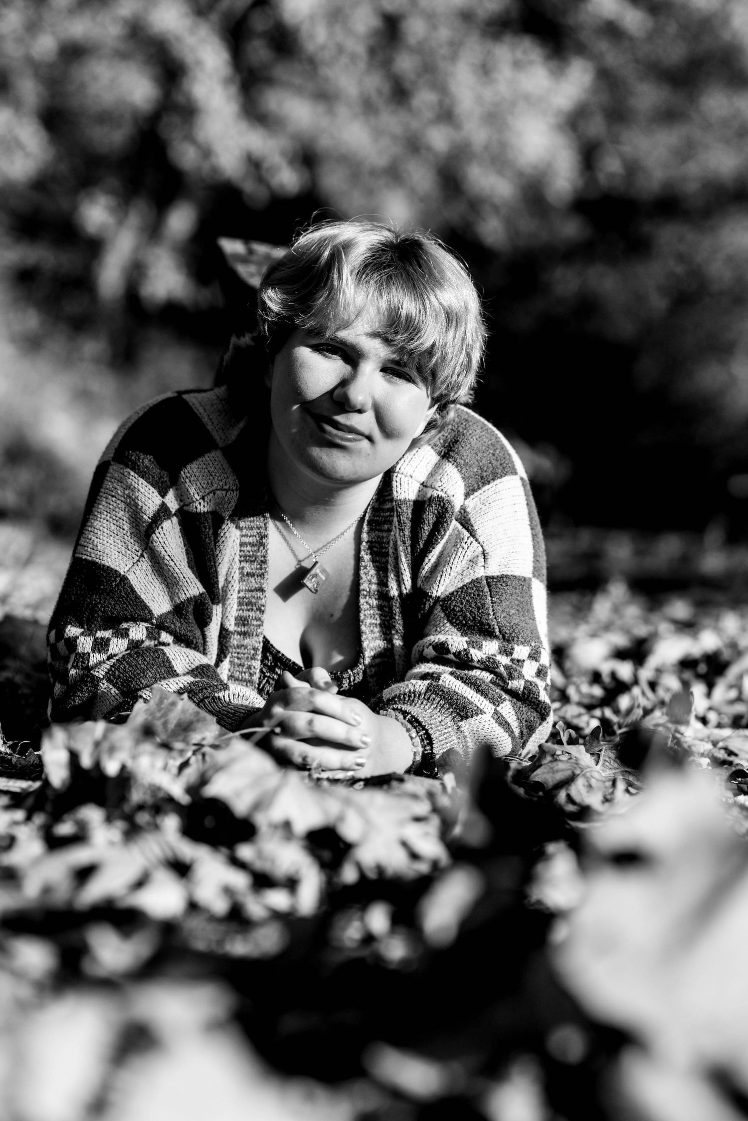 Black and white photo sequence showing playful expressions in an outdoor setting.