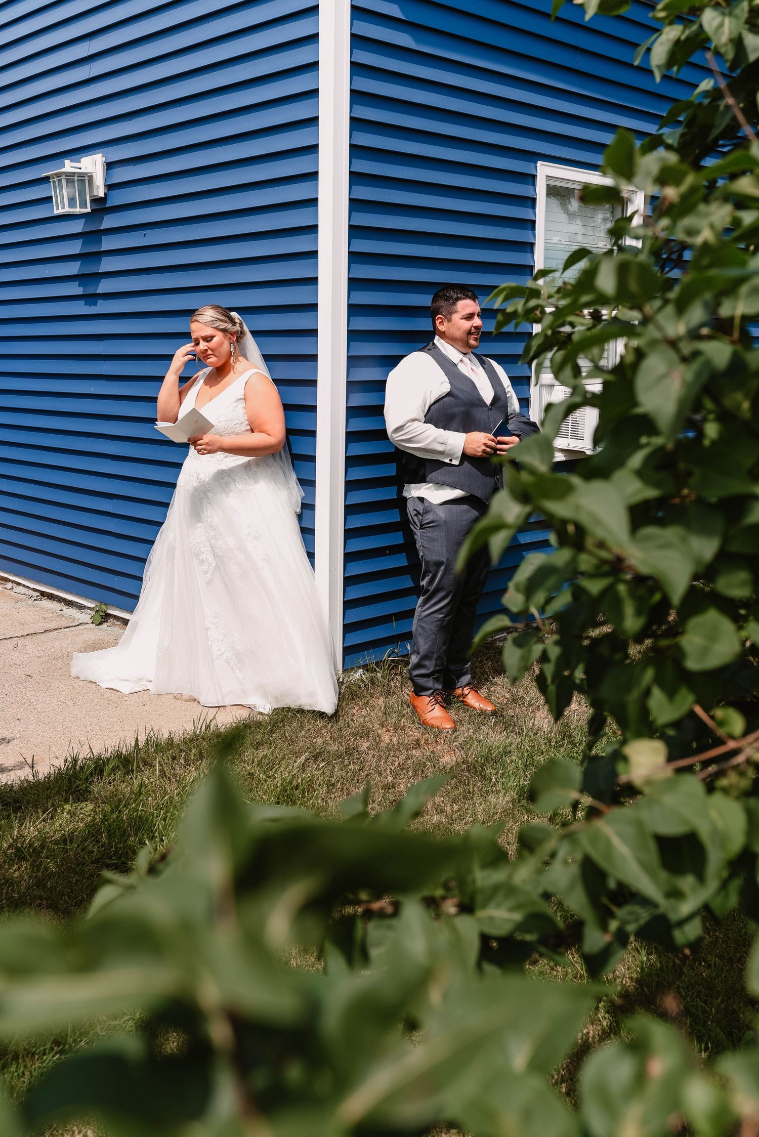 Sequence of candid moments against blue siding of a building with greenery.