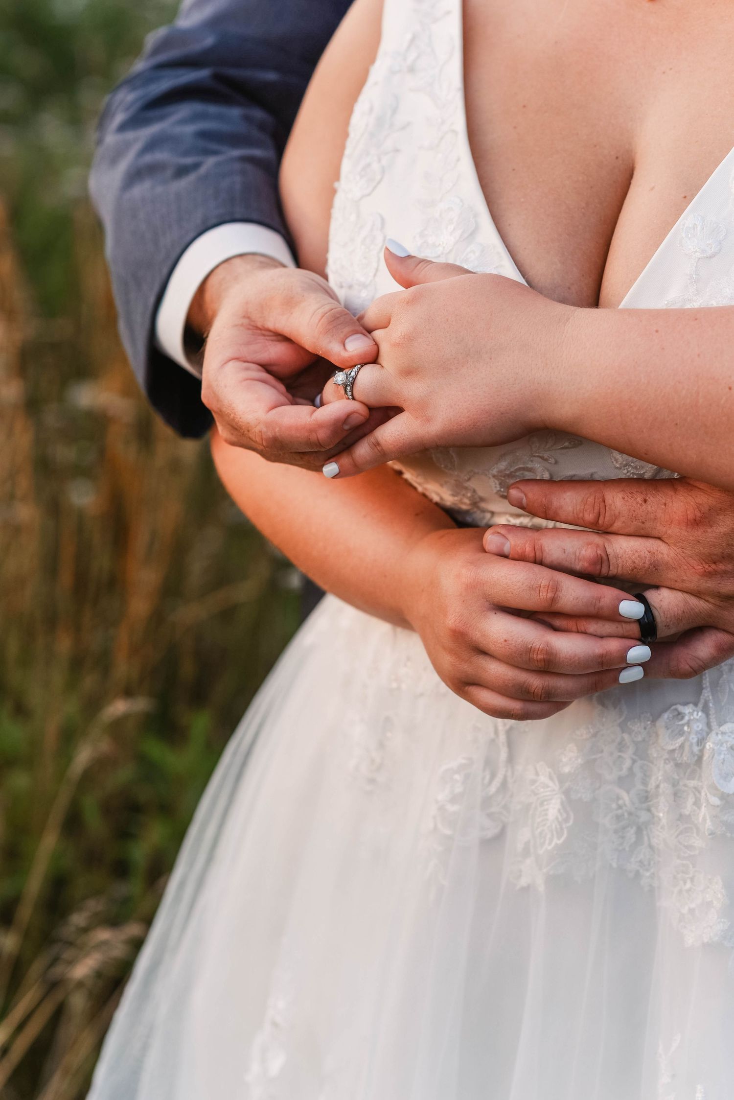 Close-up sequence of hands exchanging rings during an outdoor wedding ceremony.